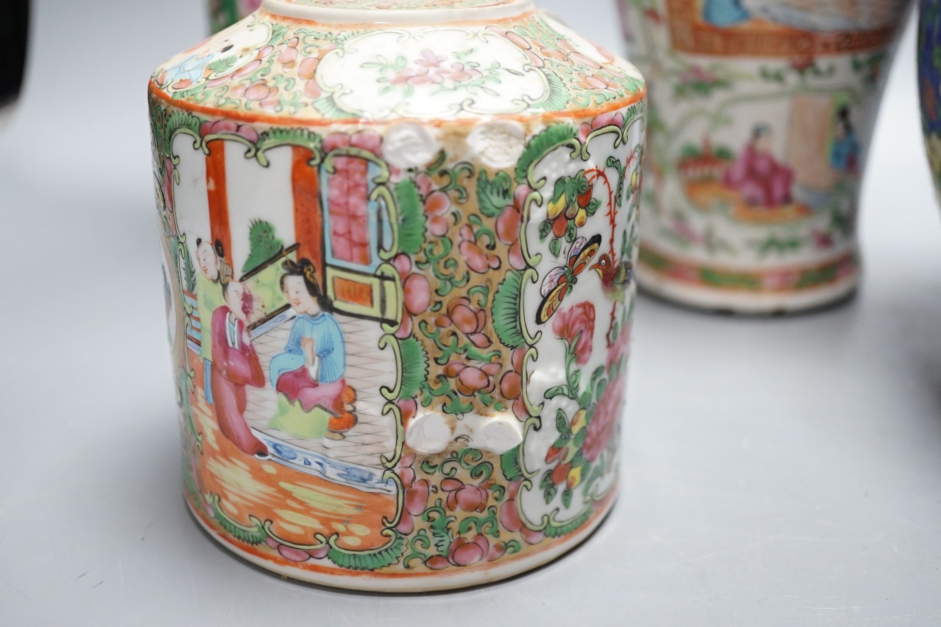 Two Chinese famille rose vases, two Chinese famille rose teapots and a blue ground enamelled jar tallest 26.5cm
